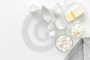 Dairy products from farm with milk, eggs, cottage, butter, yougurt on white background top view mockup