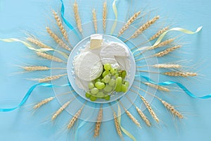 dairy products and fruits. Symbols of jewish holiday - Shavuot