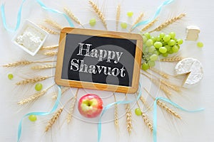 dairy products and fruits. Symbols of jewish holiday - Shavuot