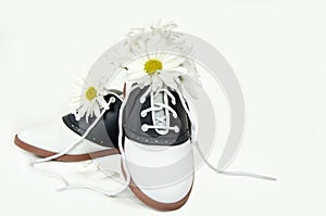 Daisy bouquet in saddle shoe photo