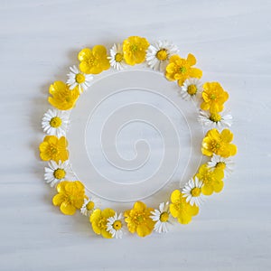 Daisy and Buttercup Wreath on White Flat Lay