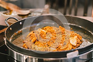 Dak-Galbi, Korean traditional food. Spicy stir-fried chicken, pork, meat, seafood, and vegetable, Served and fried on rounded hot