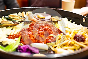 Dakgalbi or Spicy grilled chicken and vegetables recipe. photo