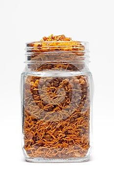 Dal Bijli or Dal moth in a glass jar, made with roasted Masoor Dal black lentils.