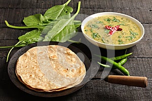 Dal palak dish served with chapathi.