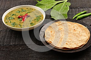 Dal palak dish served with chapathi.