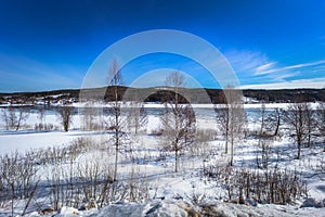 Dalarna - April 01, 2018: Wild frozen landscape of the countryside of Dalarna, Sweden