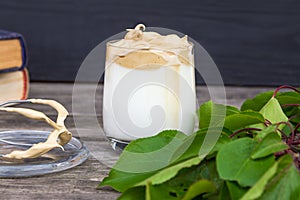 Dalgona coffee on rustic wooden background