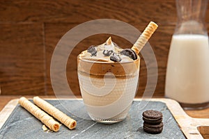 Dalgona coffee In a transparent glass. A trendy fluffy creamy whipped coffee