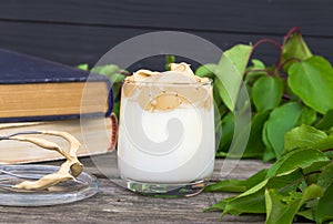 Dalgona coffee on wooden rustic background