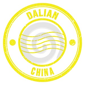 DALIAN - CHINA, words written on yellow postal stamp