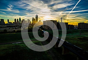 Dallas Texas Skyline Downtown Cityscape Sunrise sun rays over Urban Prawl massive City