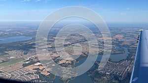 Dallas, TX USA - September 26, 2021: The view of from an airplane of it landing at the Dallas Fort Worth Airport DFW with a lake