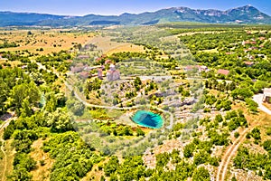 Dalmatia hinterland. Cetina river source and Orthodox church aerial view