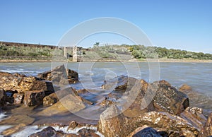 Dam of Cornalvo Reservoir from shore, Spain