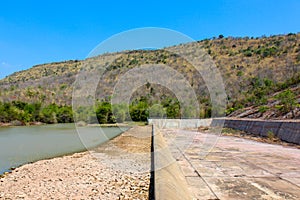 The dam crest the concrete spillway. countryside blocks the river to store water