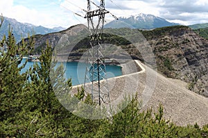 Dam and electricity pole, Lake Serre-Poncon, French Hautes-Alpes