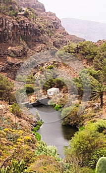 Dam of the header of the Arure ravine in La Gomera, Canary Islands Spain photo