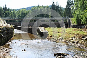 Dam Hradiste with regulated riverbed of river Cerna - Black