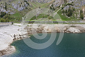 The dam of Lago di Fedaia, at the foot of the Marmolada mountain. Trento, Itlay. photo