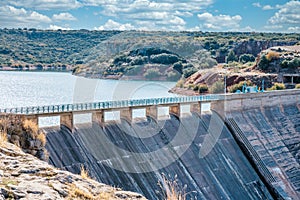 Dam in the reservoir with blue railings