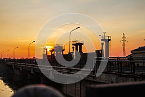 Dam on the river at sunset