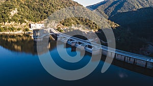 Dam of the Sau Reservoir in the Province of Girona, Catalonia, Spain. Amazing aerial view in a sunny day