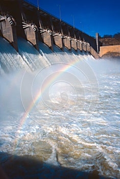 Dam spillway with rainbow photo