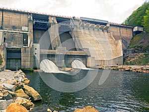 Dam and turbines of a hydroelectric power station with falling water flows