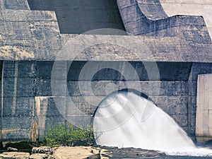 Dam and turbines of a hydroelectric power station with falling water flows