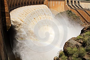 Dam wall with open sluice gates