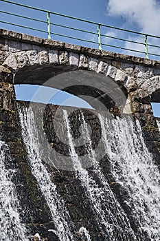 The dam and waterfall on the river Lomnica