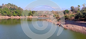 a dam whose water recedes due to the dry season photo