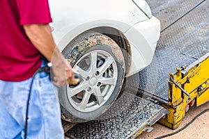 Damage and accident  car. Blur hand man hold remote control car tow in the park