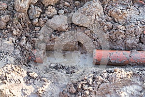 Burst water pipe on construction site photo