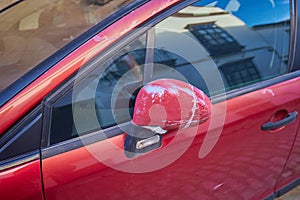 Damage of the paint on the rear mirror after car accident