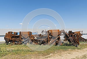 Damaged agricultural equipment destroyed by artillery fire