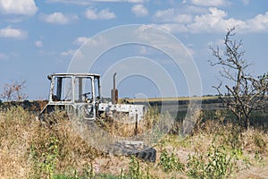 Damaged agricultural equipment destroyed by artillery fire