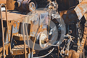 Damaged agricultural equipment destroyed by artillery fire (close-up)