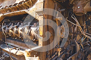 Damaged agricultural equipment destroyed by artillery fire (close-up)