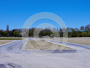 Damaged asphalt road under blue sky