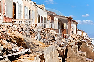 Damaged beach houses. Spain