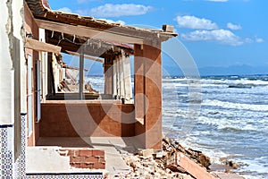 Damaged beach houses. Spain