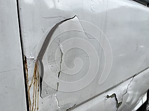 Damaged car because of accident with cracked surface