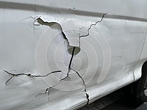 Damaged car because of accident with cracked surface