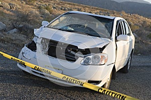 Damaged Car Behind Warning Tape