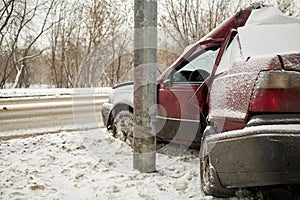 Damaged car crashing side into lamppost in photo