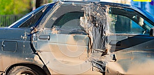 Damaged car after incident on a road