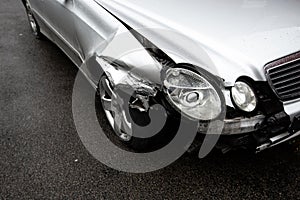 A damaged car in a road traffic accident