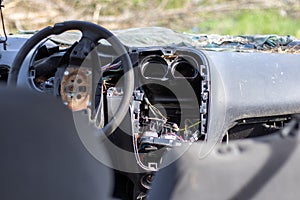 Damaged car window after an accident. Broken windshield as a result of an accident, inside view. Cabin interior details, view from